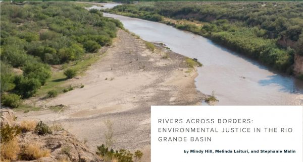 Image is a photograph of the Rio Grande River flanked by brown sand banks and green sage brush.